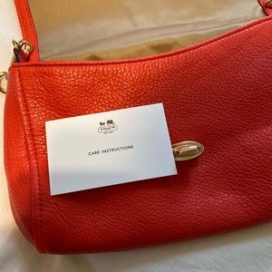 COACH crossbody clutch with gold chain strap